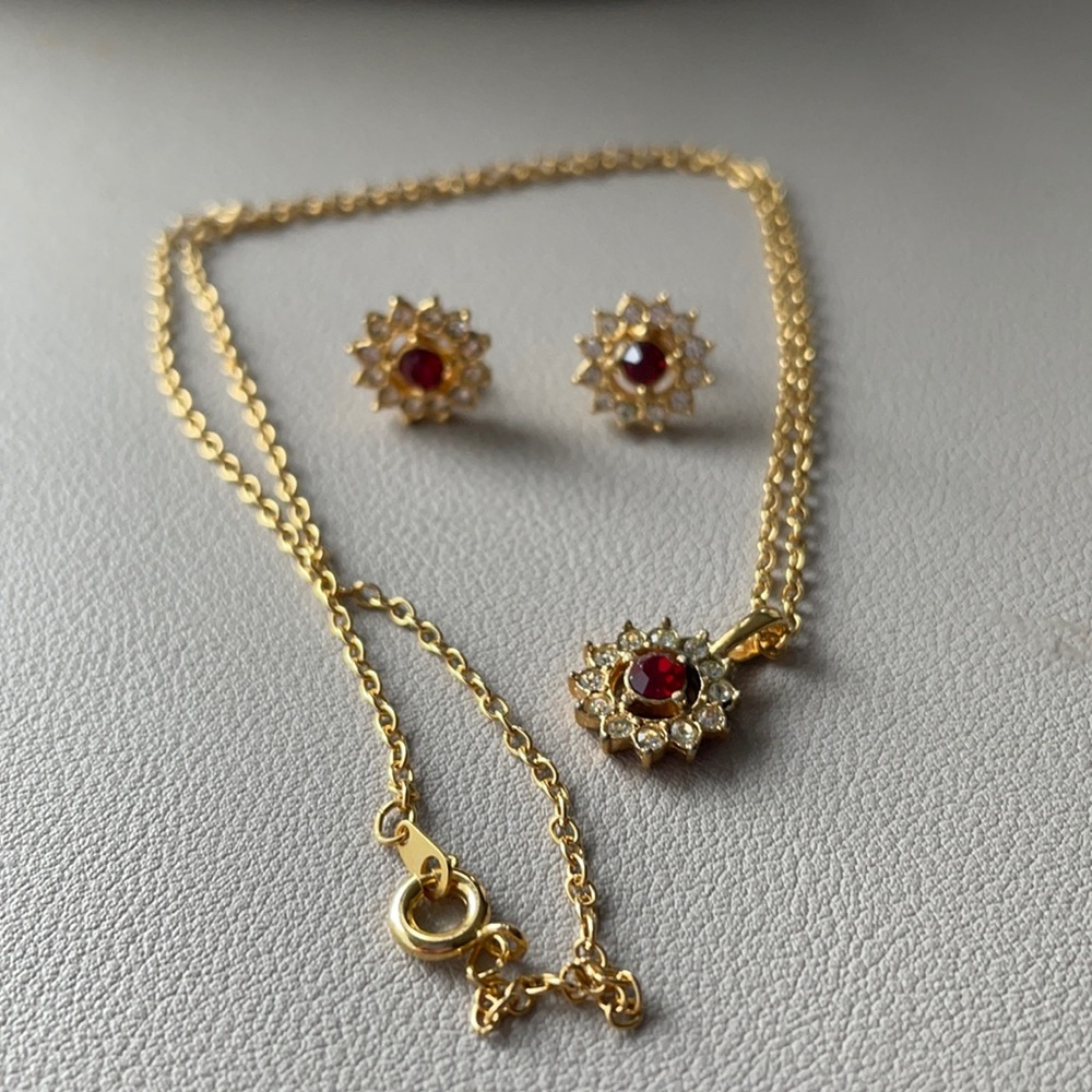 Matching set red stone gold tone necklace earrings